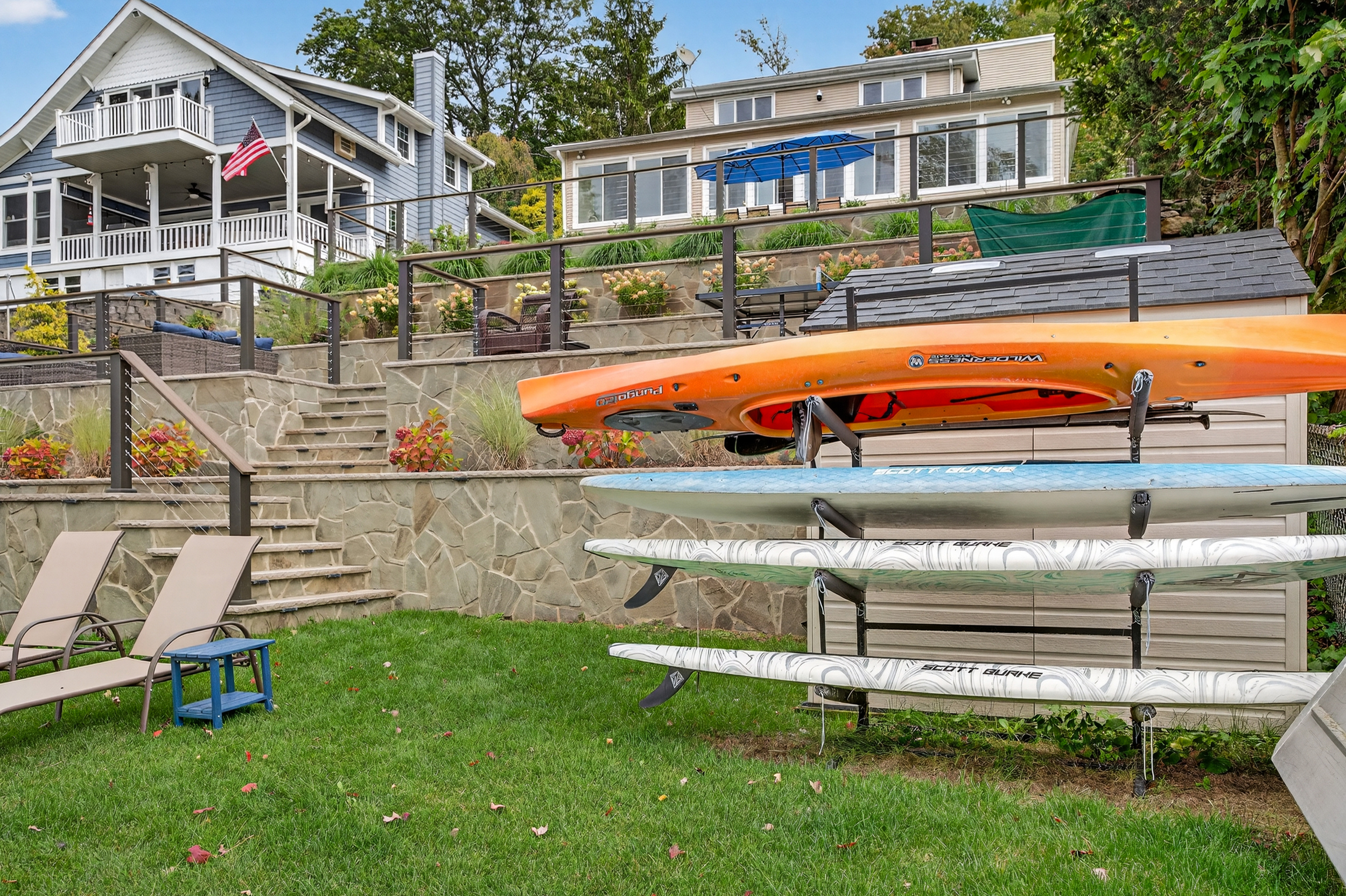 kayaks and paddle boards with plenty of life jackets  available for use